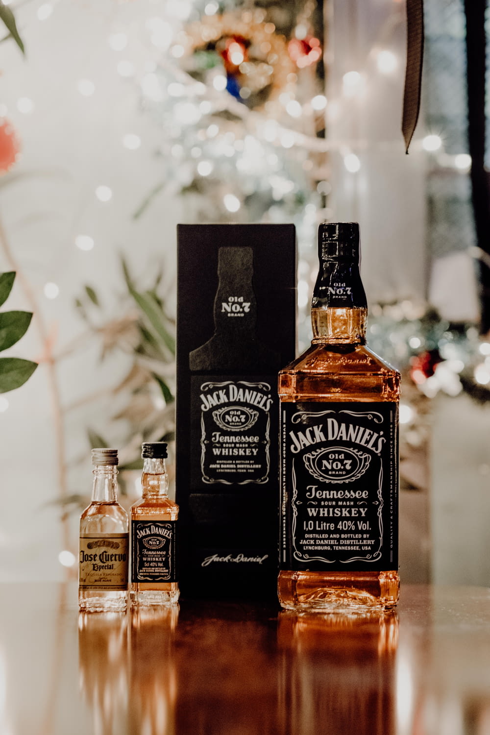 three bottles of jack daniels on a table