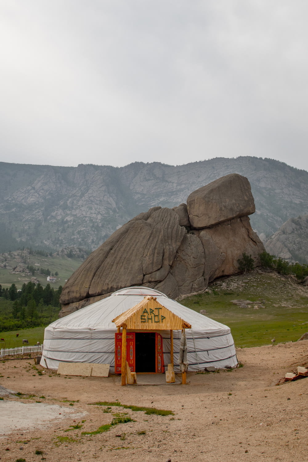 a yurt with a mountain in the background