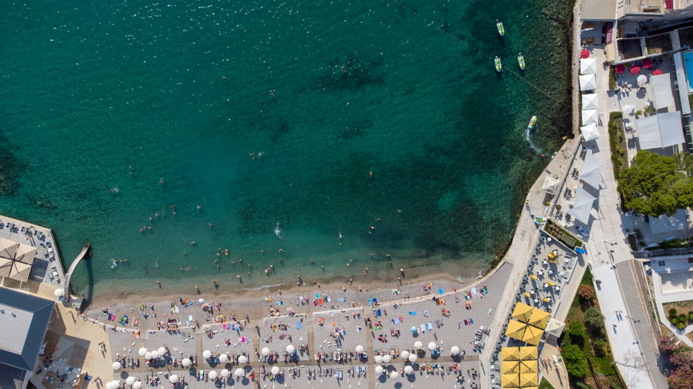 an aerial view of a beach with a lot of people