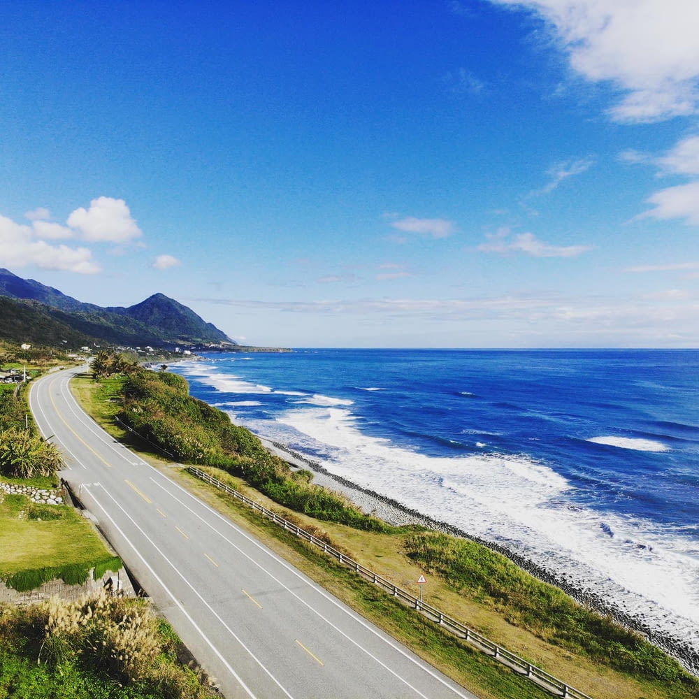 a scenic view of the ocean and a highway