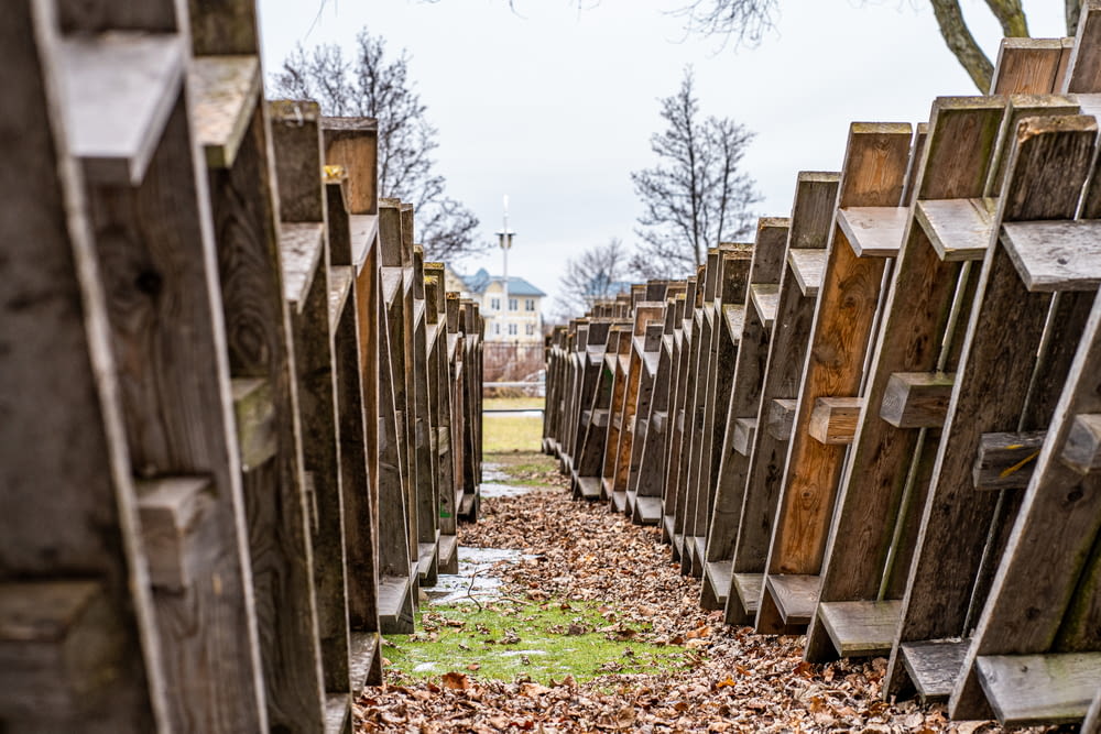 a row of wooden crosses sitting next to each other