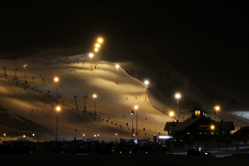 a ski slope at night with a lot of lights
