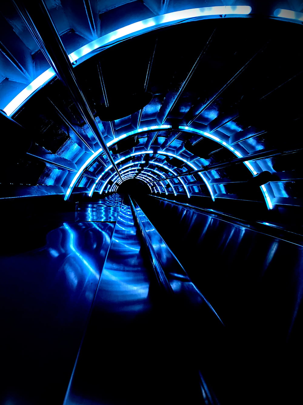 a tunnel with blue lights in the middle of it