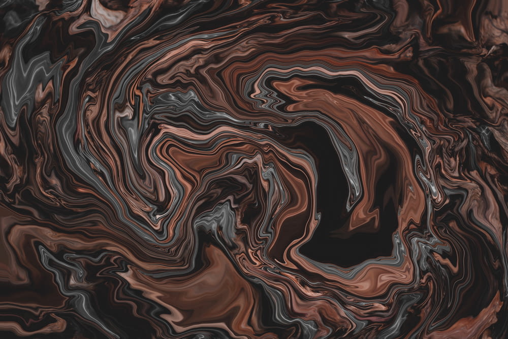 uno sfondo astratto nero e marrone con linee ondulate