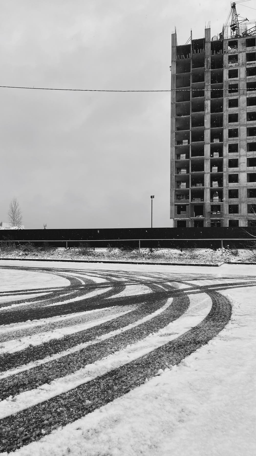 a black and white photo of a building in the snow