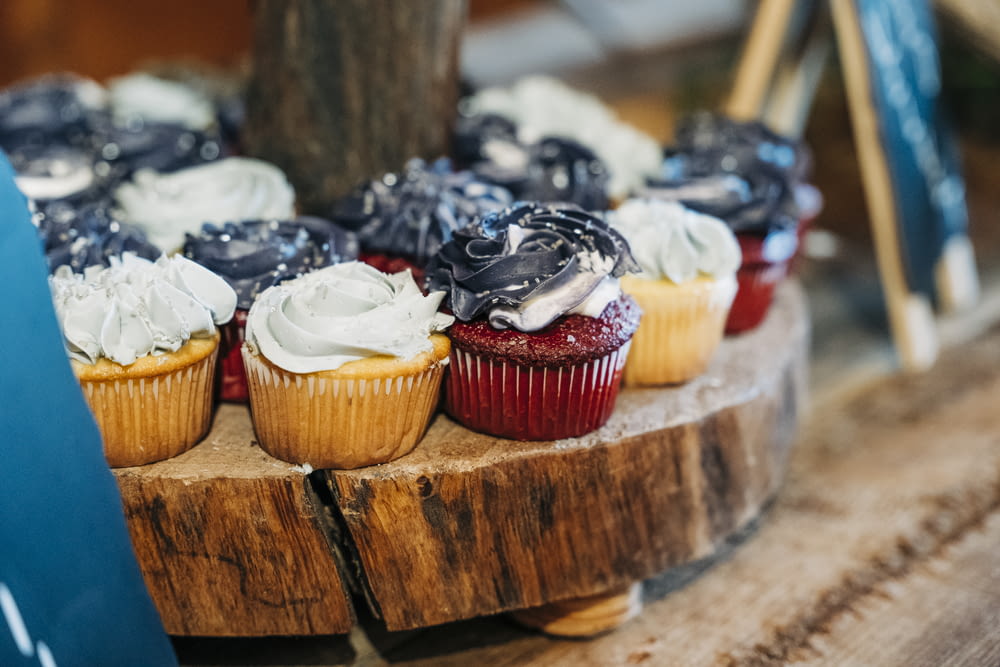 a close up of cupcakes on a wooden table
