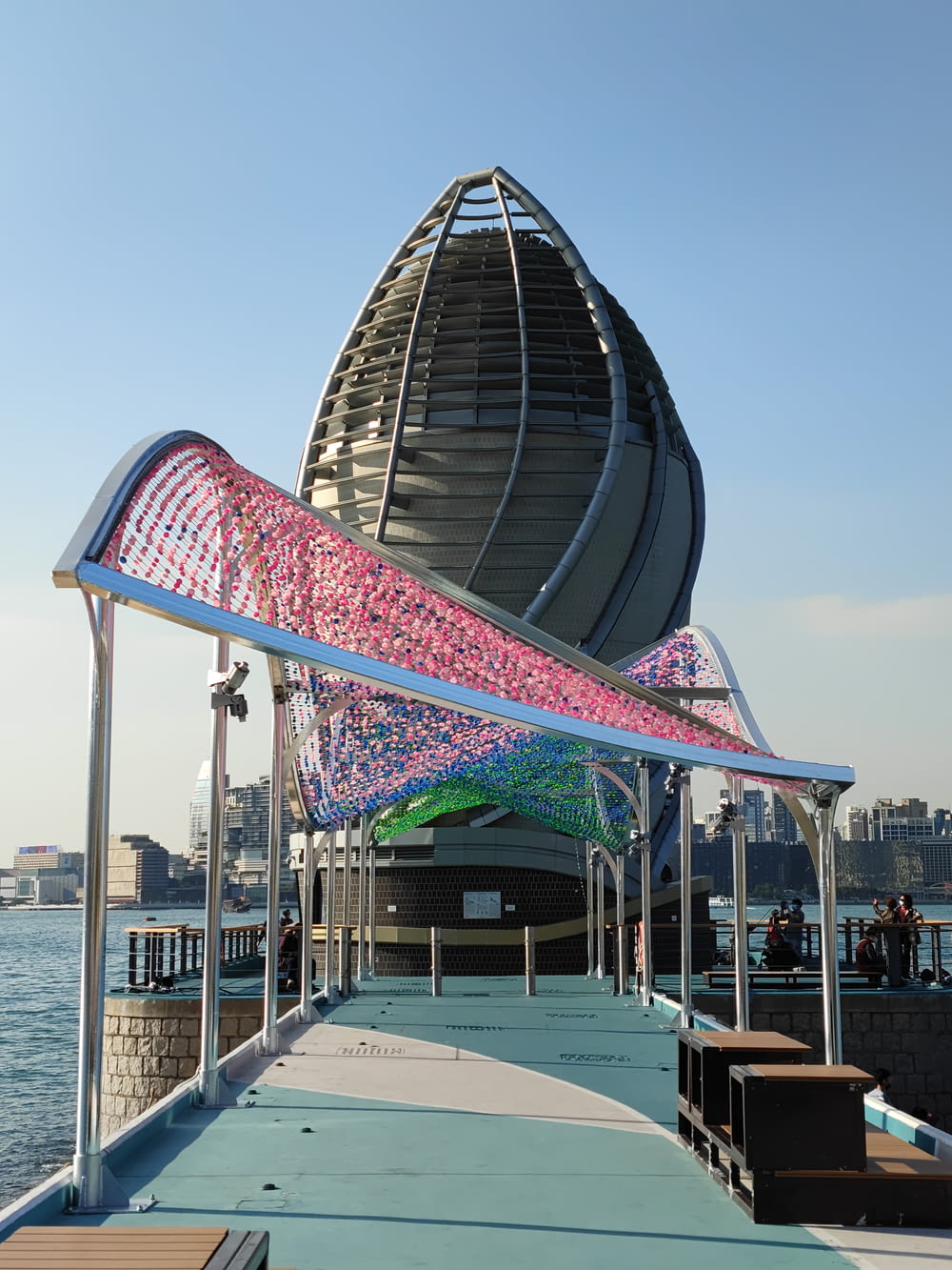 a boat dock with a colorful structure on top of it