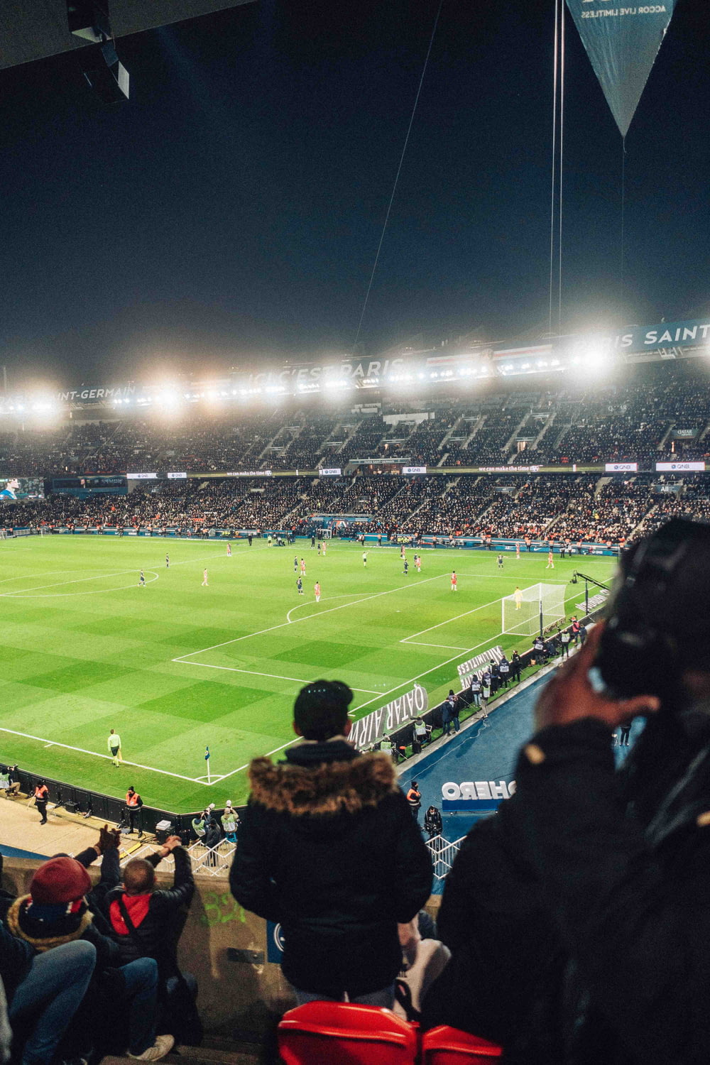 a stadium filled with people watching a soccer game