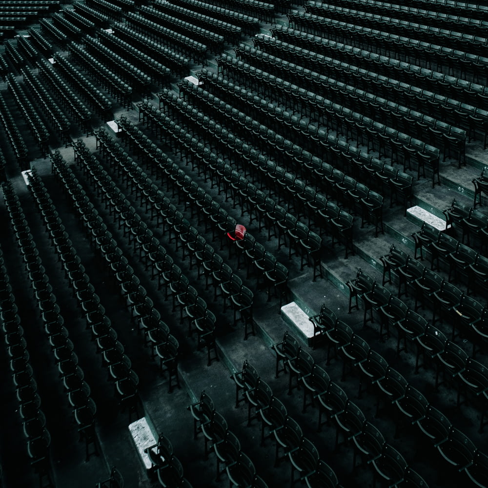 an empty stadium with rows of empty seats