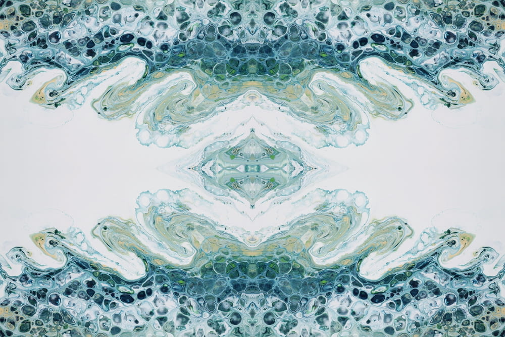 uma imagem de um padrão composto de cores azuis e verdes