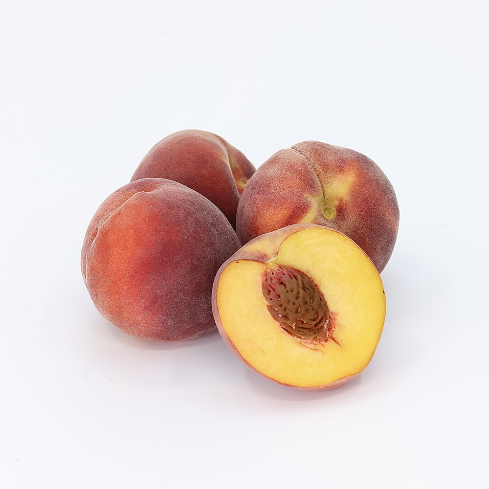 a couple of peaches sitting on top of each other