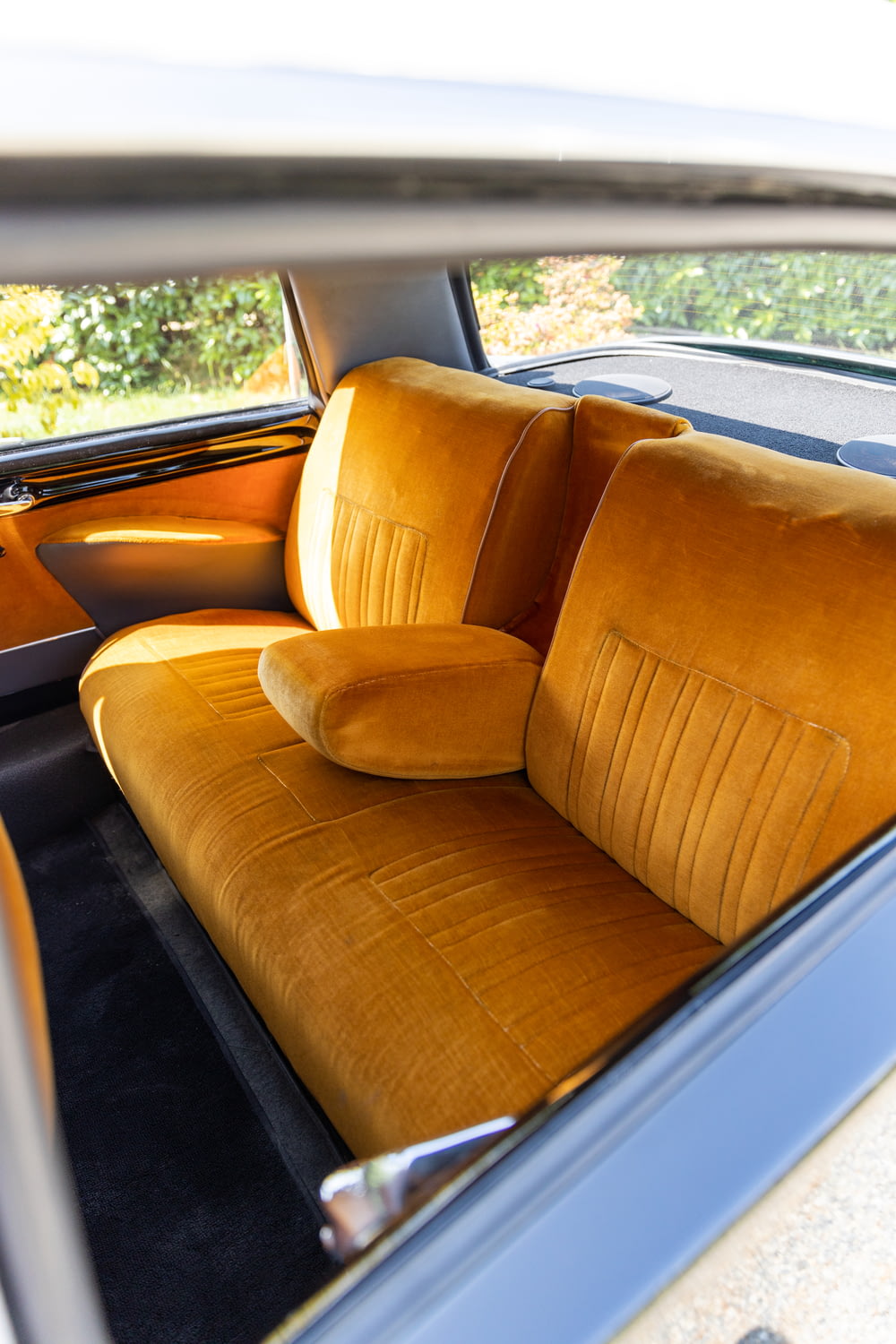 the interior of a car with a yellow seat