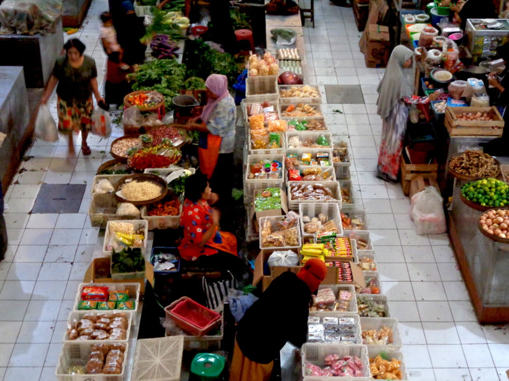 a group of people shopping in a market