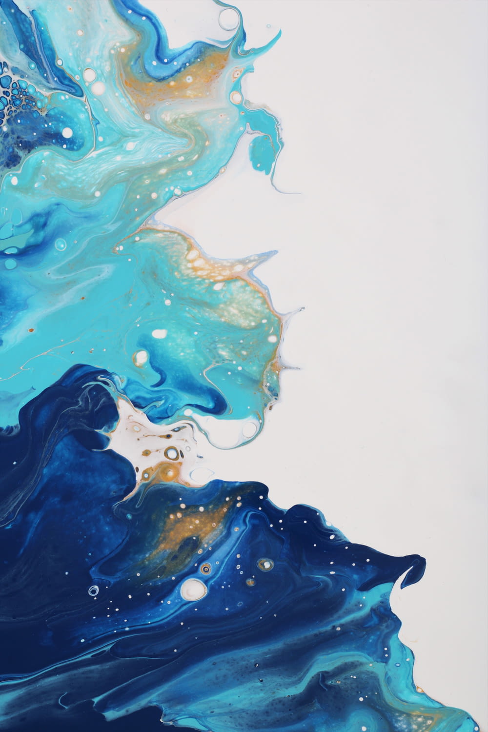 an abstract painting of blue and gold colors