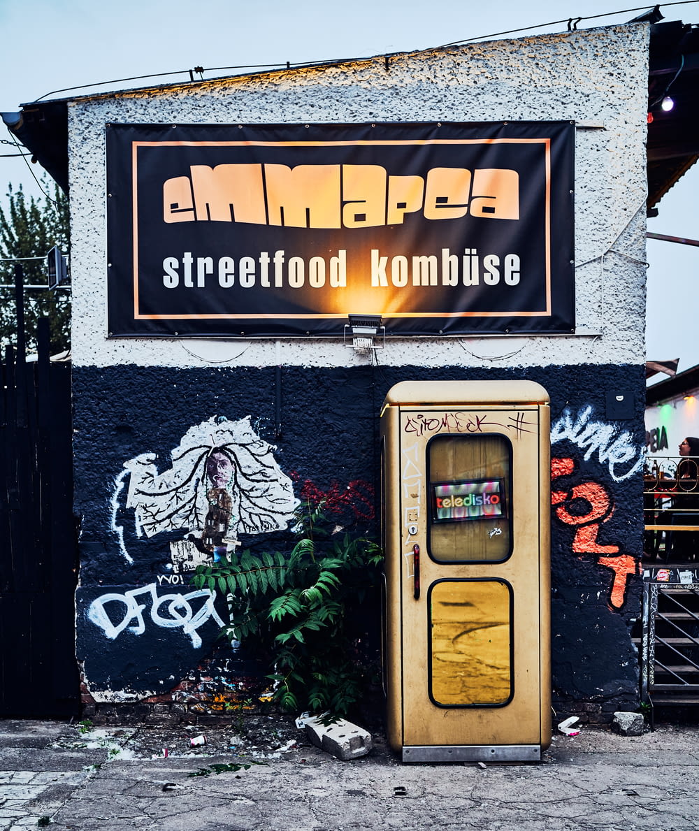 a street food kombissee with graffiti on the side of a building