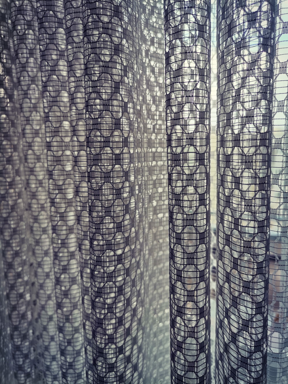 a close up of a curtain with circles on it