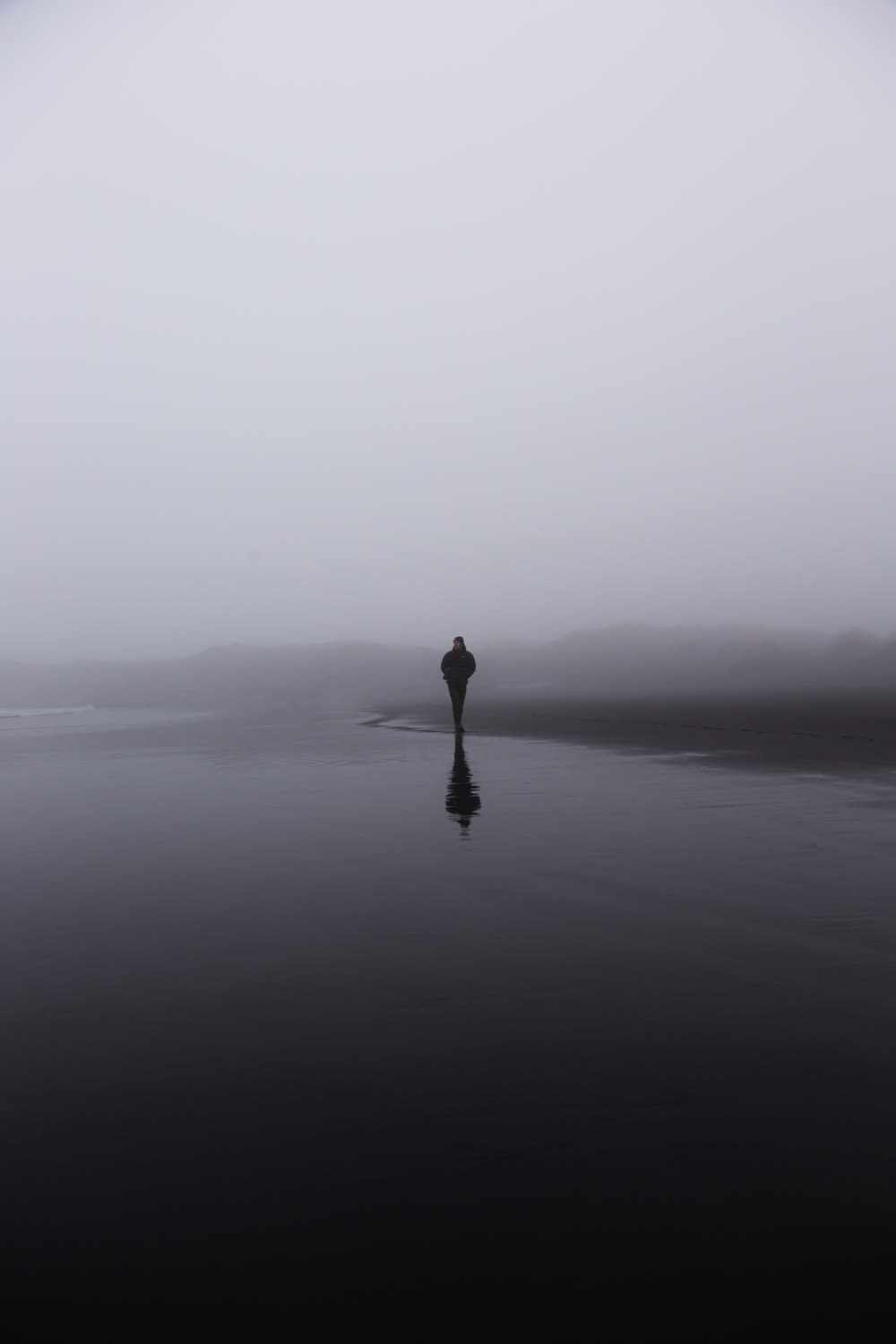 a person standing in the middle of a body of water