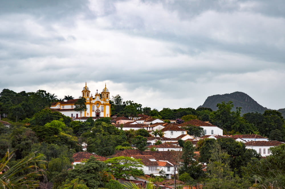 a view of a town with a church on top of it