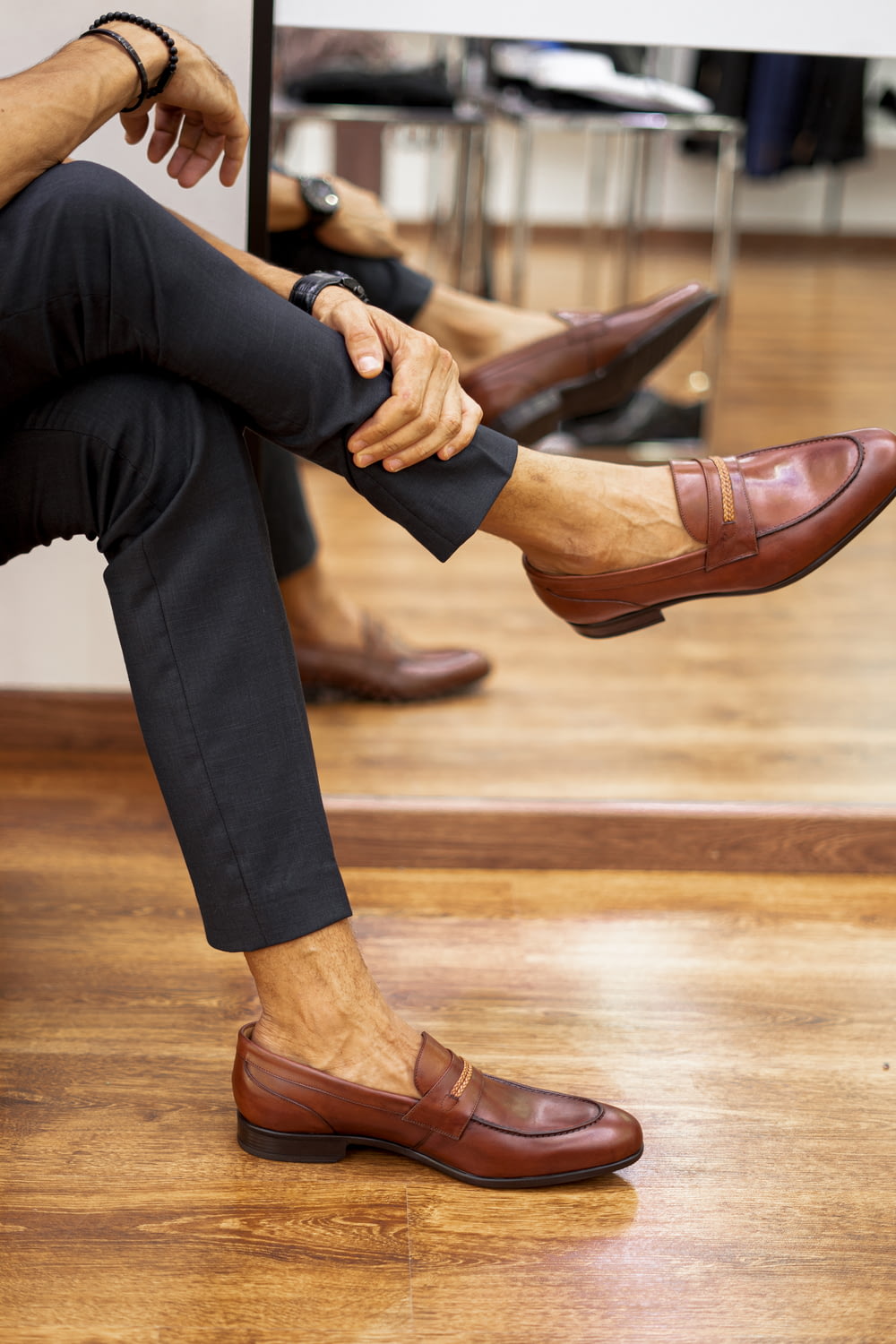 a pair of men's shoes sitting on a wooden floor