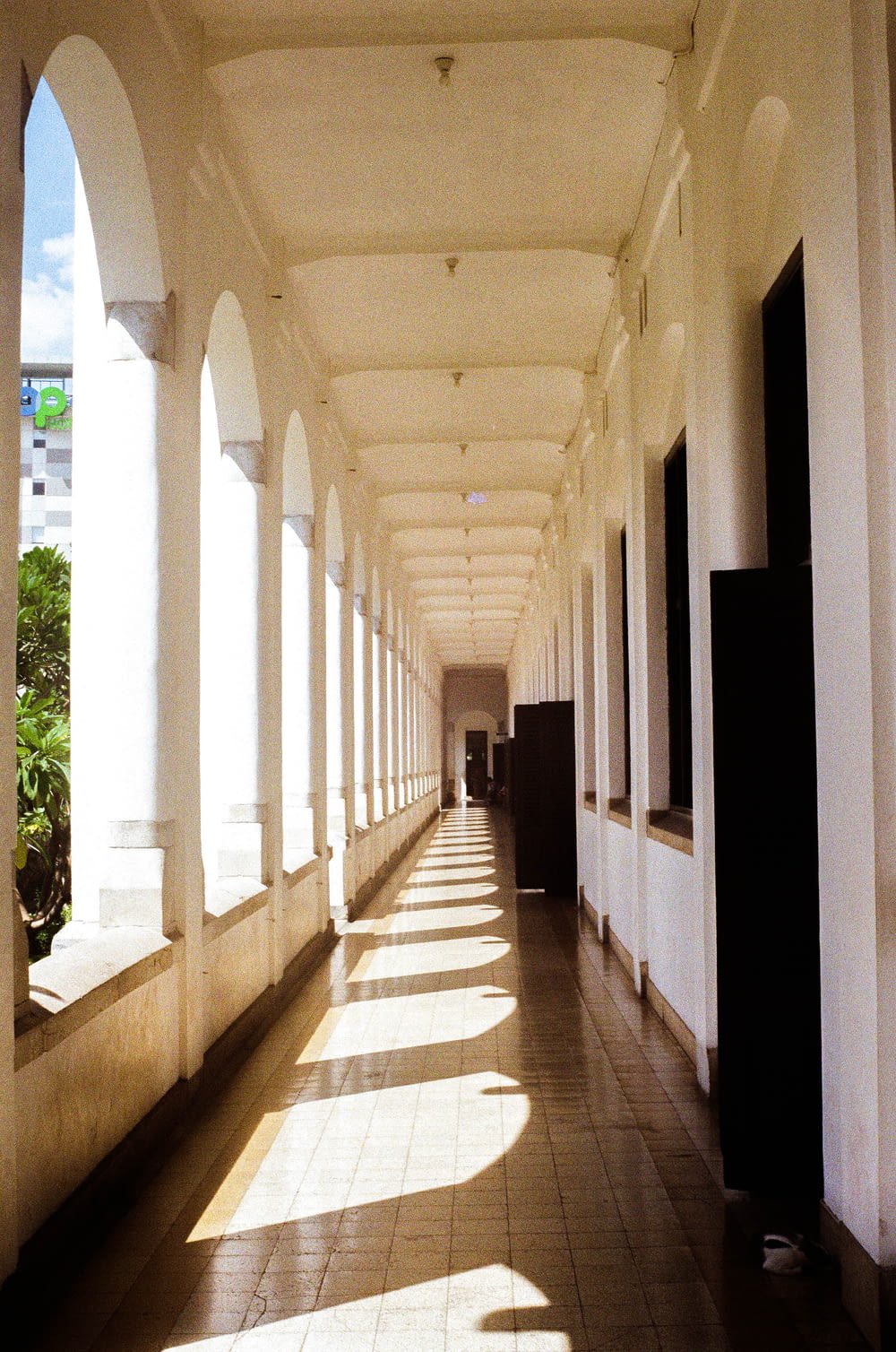 a long hallway lined with columns and windows