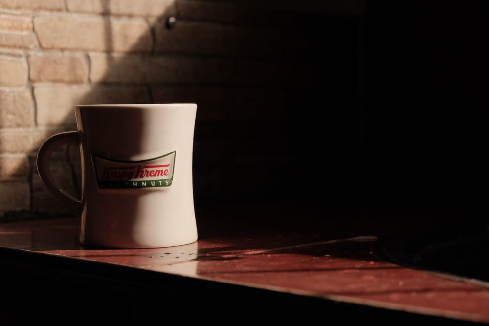 a coffee cup sitting on top of a counter