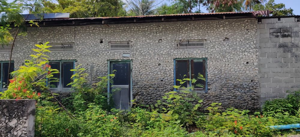 a building made out of rocks with windows