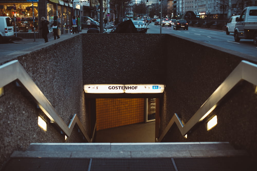 an entrance to a subway station with a sign above it