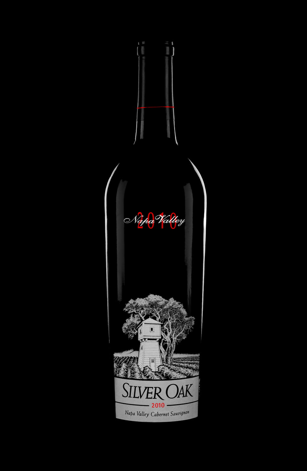 a bottle of silver oak wine on a black background