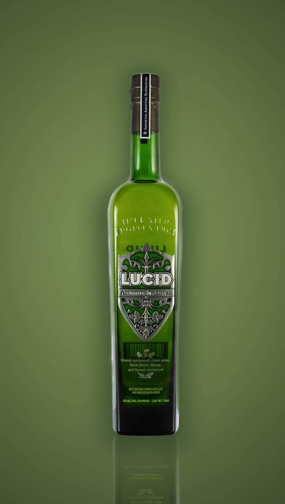 a bottle of liquor on a green background