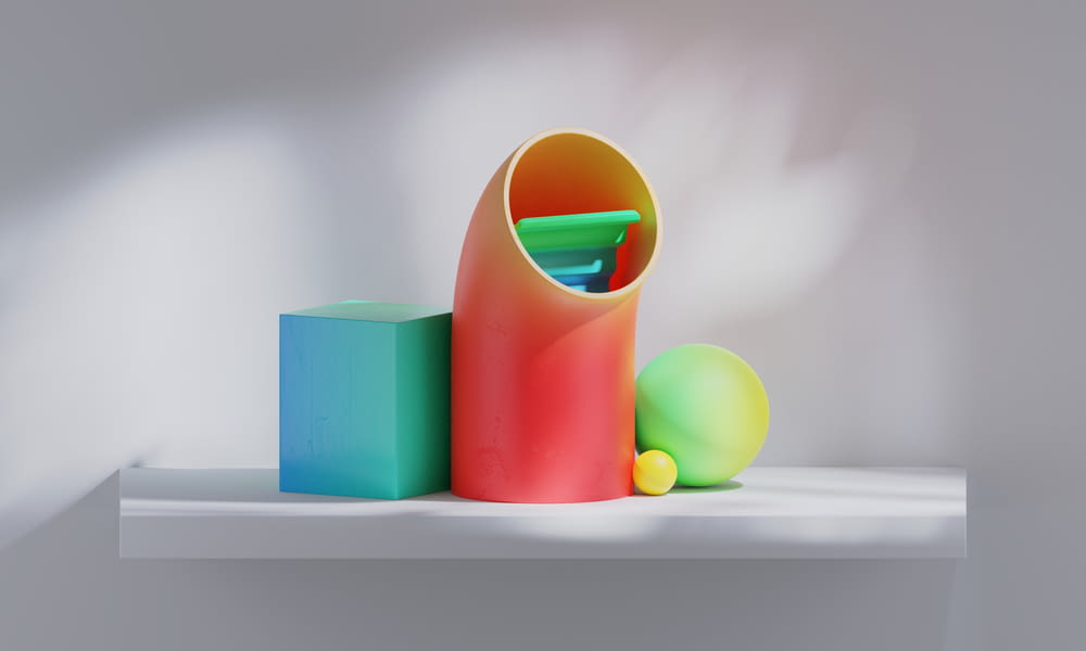 a group of colorful objects sitting on top of a white shelf