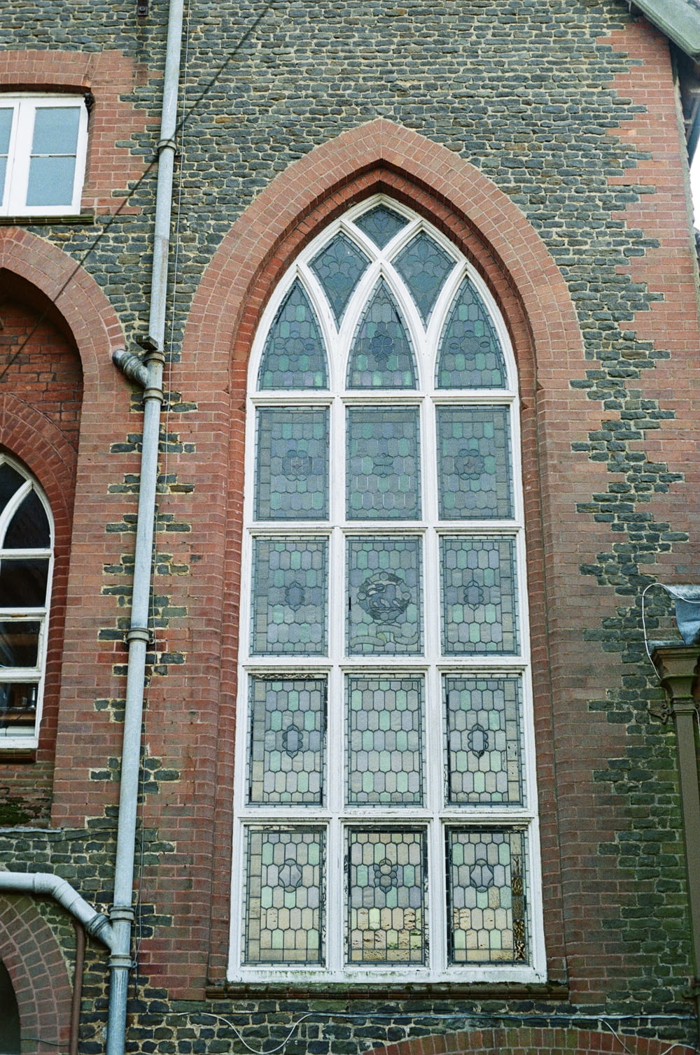 a tall brick building with a large window