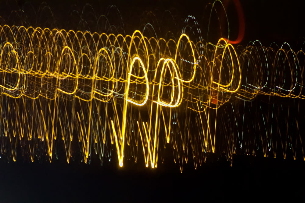 a long exposure photo of lights in the dark