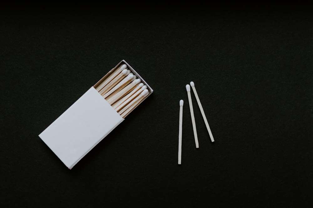 a box of matches and four matches sticks