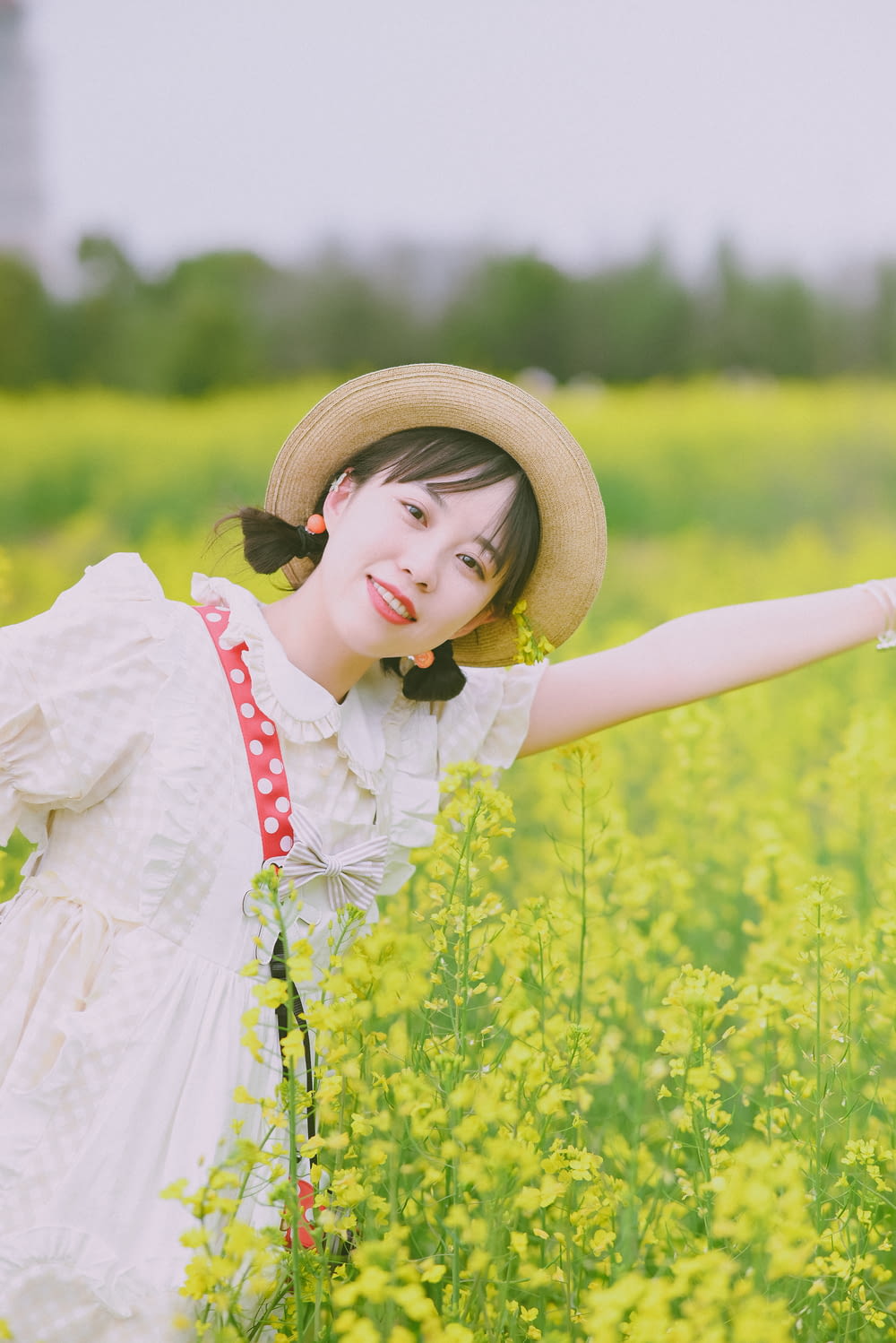 a young girl in a field of yellow flowers