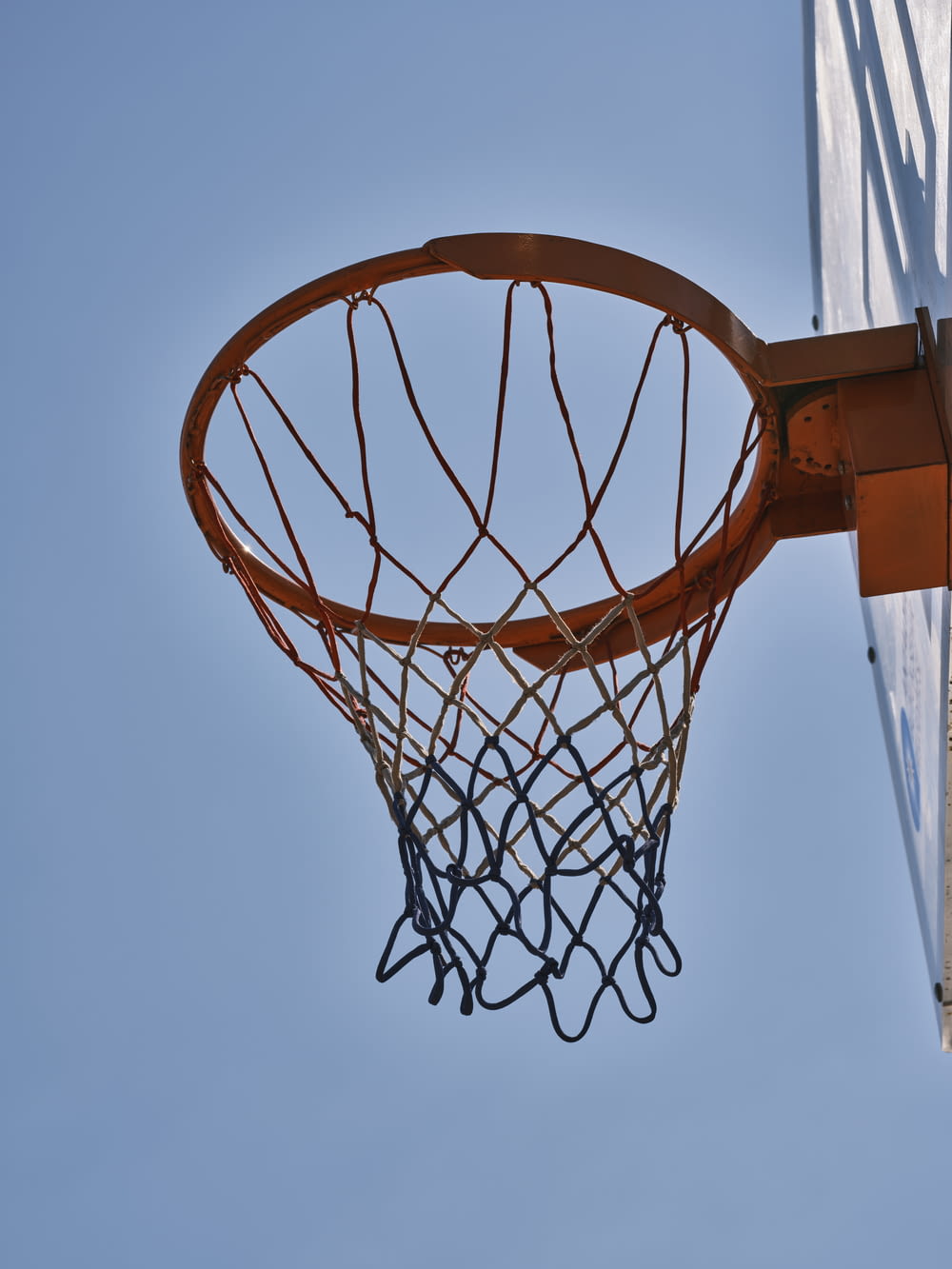 a basketball going through the net of a basketball court
