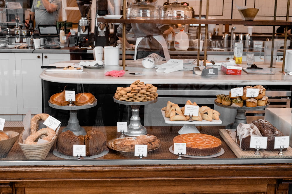 a bakery counter filled with lots of pastries
