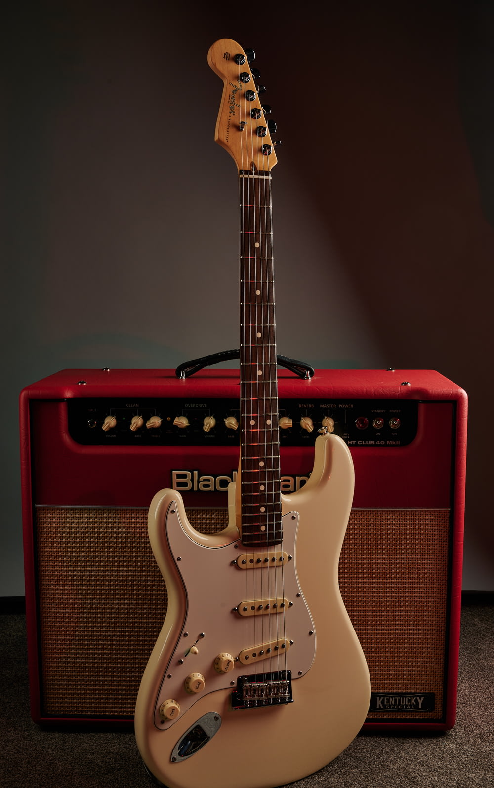 an electric guitar sitting next to an amp