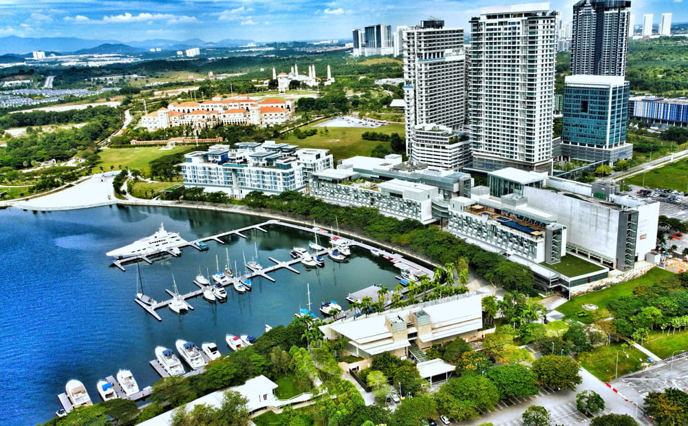 an aerial view of a marina with boats and buildings