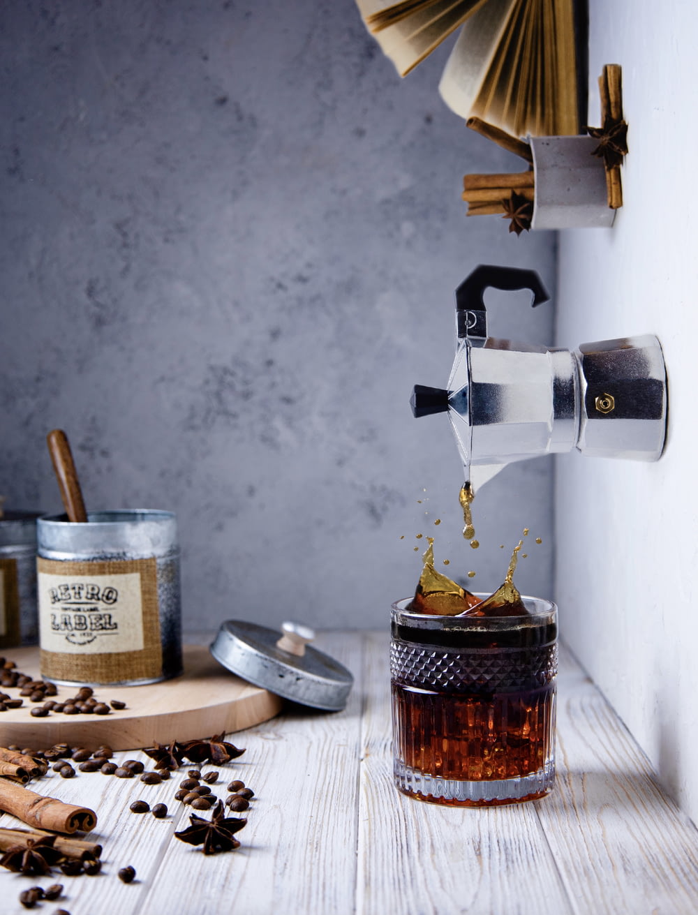 a coffee grinder pouring coffee into a jar