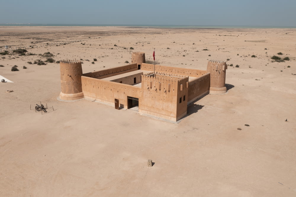 a building in the middle of a desert