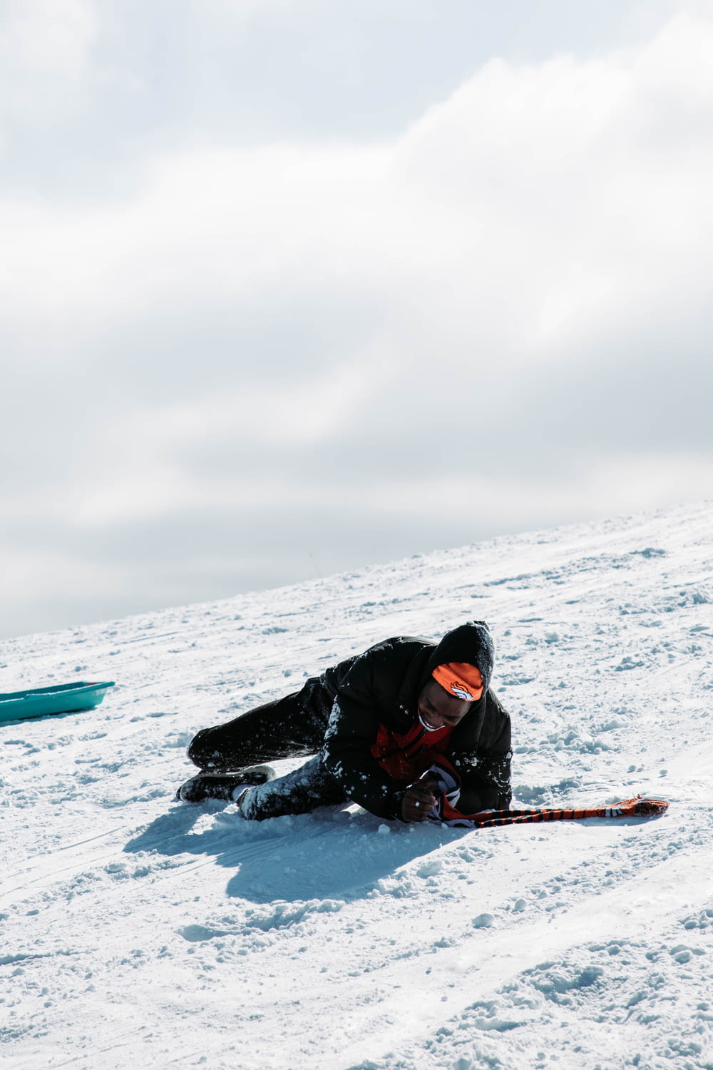 a person on skis laying in the snow