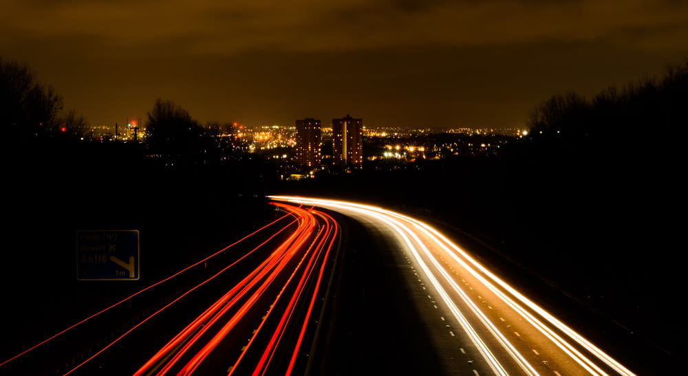 a long exposure shot of a highway at night