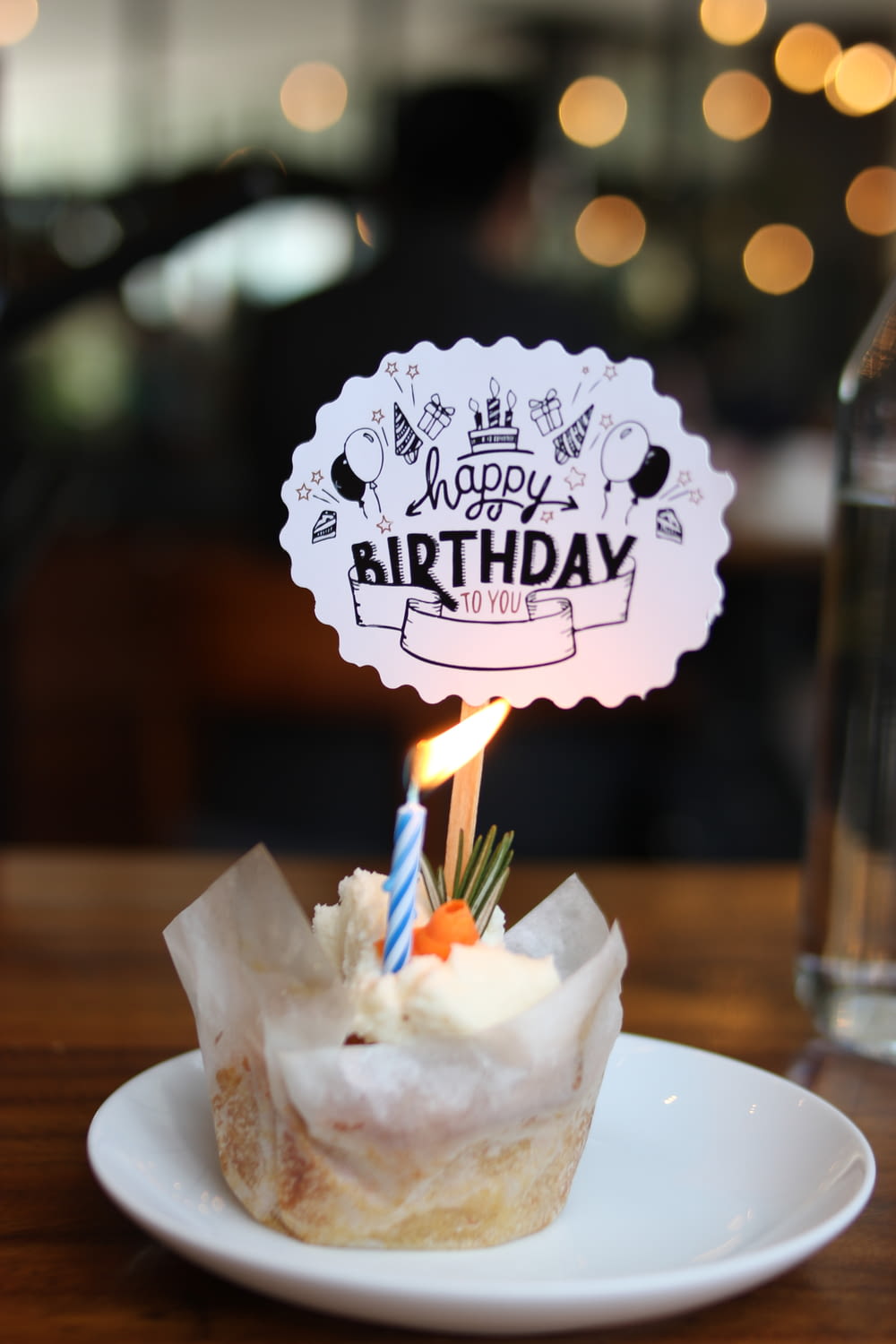 a birthday cupcake with a candle sticking out of it