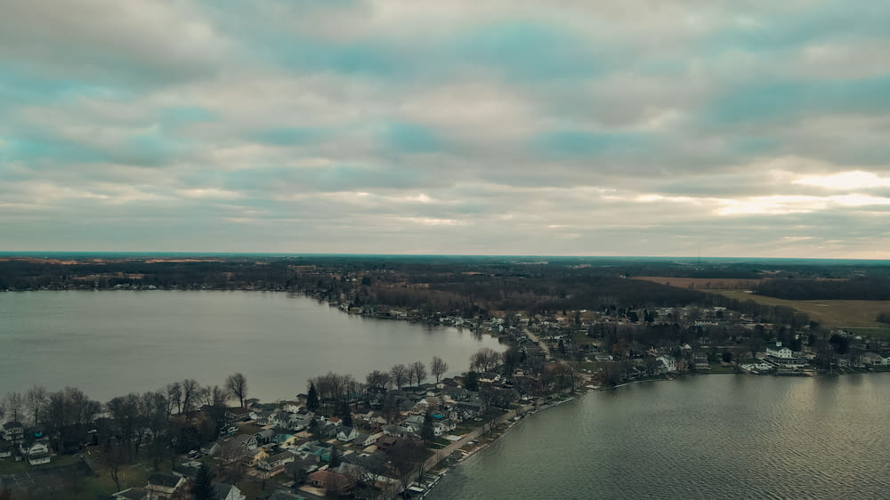 a large body of water surrounded by a small town