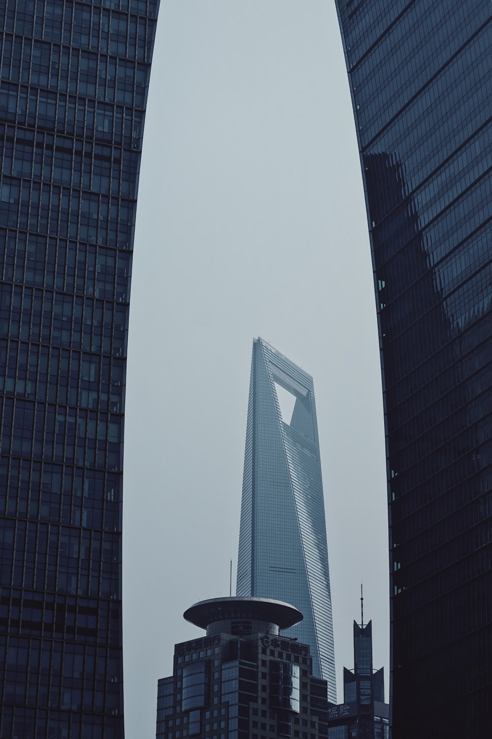 a very tall building towering over a city