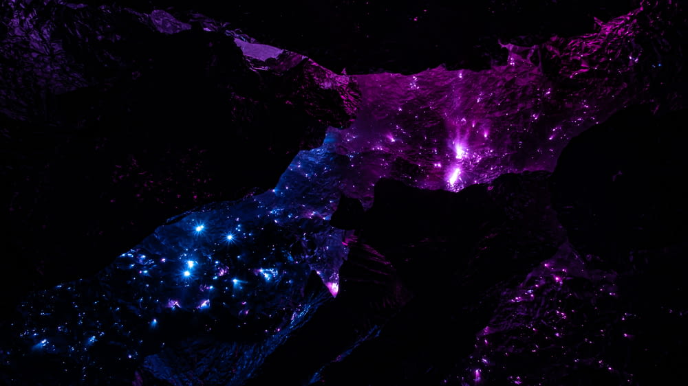 a purple and blue space filled with stars