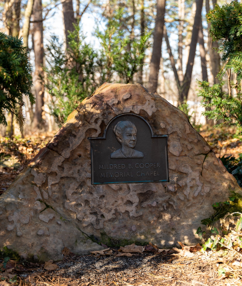 a stone monument with a picture of a man on it