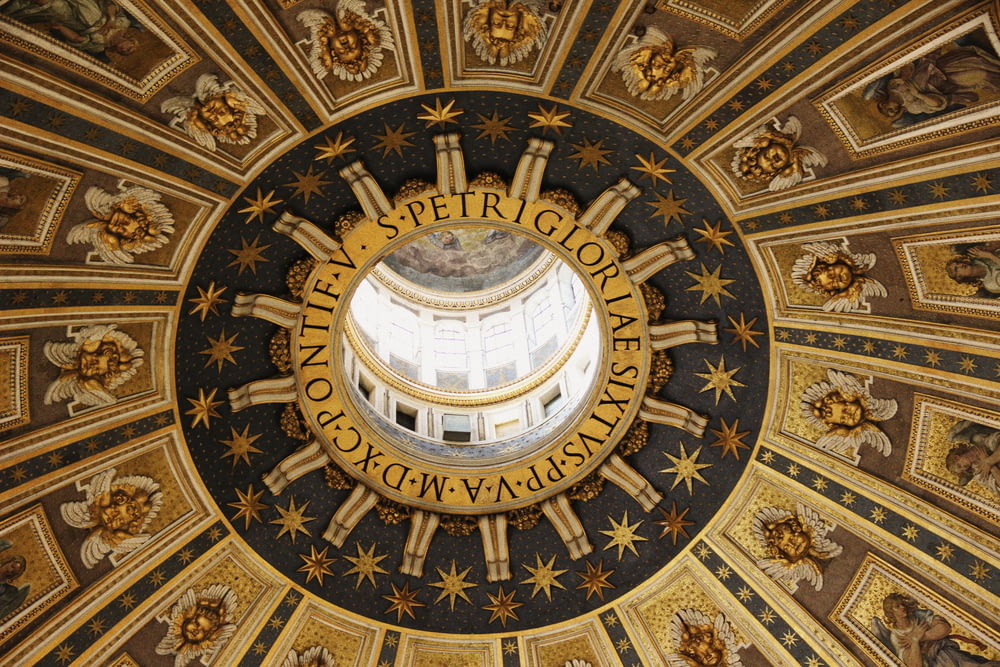 a domed ceiling with gold and black designs