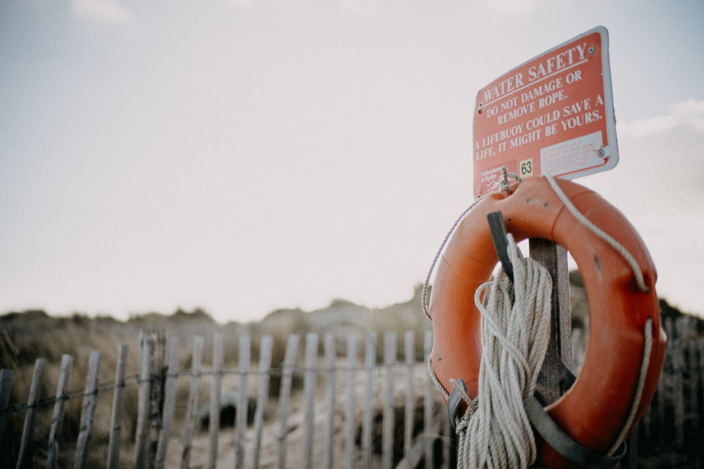 a life preserver with a sign on top of it