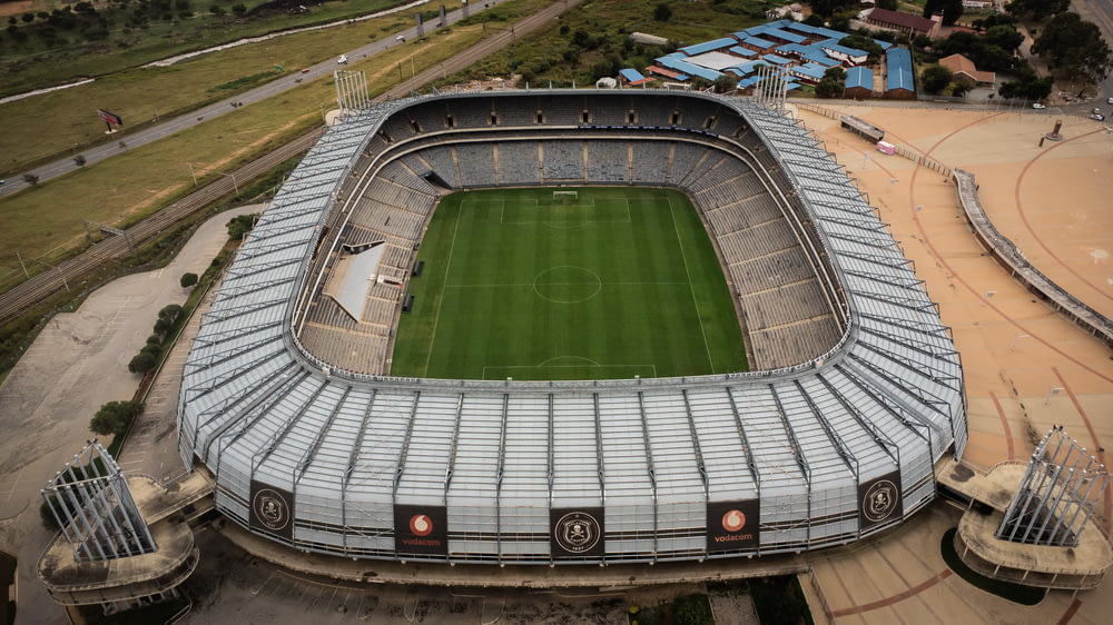 an aerial view of a stadium with a soccer field